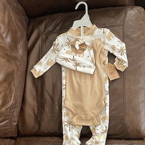 Boys 0-3 month footie pajamas, brand new with tags.